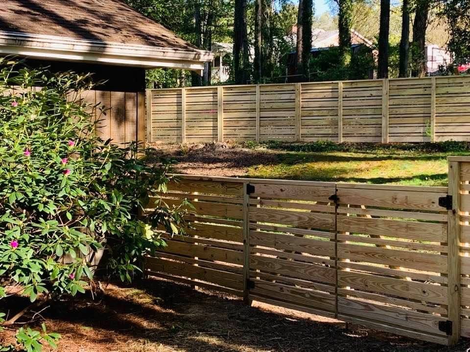 Horizontal slat wood privacy fence with matching gate